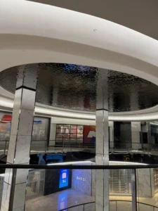 Water ripple stainless steel panels installed in a circular ceiling feature at Westfield Bondi, NSW
